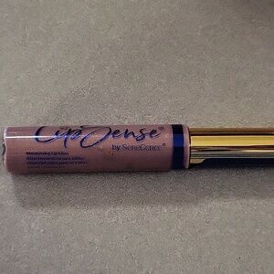 Senegence moisturizing lip gloss in Taurus sign, new in pkg